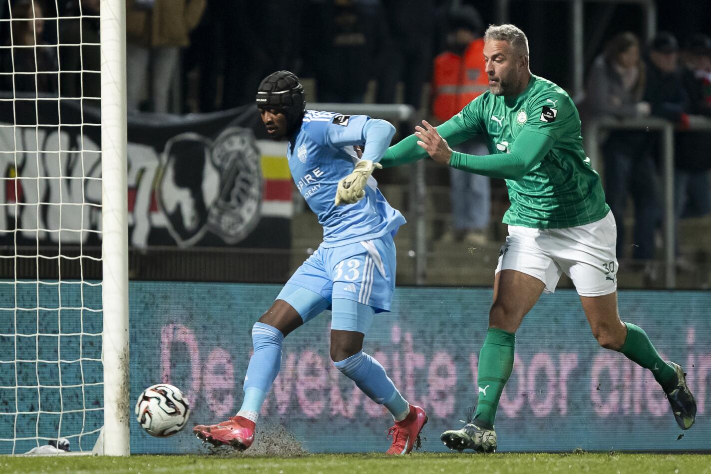 Eupen's goalkeeper Abdul Nurudeen and Lommel's Ralf Seuntjens pictured during a soccer game between Lommel SK and KAS Eupen, Saturday 24 January 2026 in Lommel, on day 21 (out of 30) of the 2025-2026 'Challenger Pro League' 1B second division of the Belgian championship. BELGA PHOTO KRISTOF VAN ACCOM