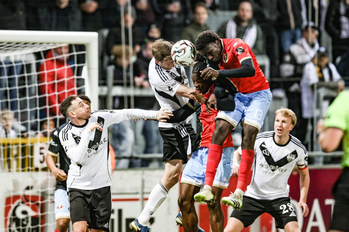 Eupen's Scott Kennedy, Seraing's Hemsley Chizorba Akpa-Chukwu and Seraing's Hady Camara fight for the ball during a soccer game between KAS Eupen and RFC Seraing, Friday 20 March 2026 in Eupen, on day 31 of the 2025-2026 'Challenger Pro League' 1B second division of the Belgian championship. BELGA PHOTO BRUNO FAHY